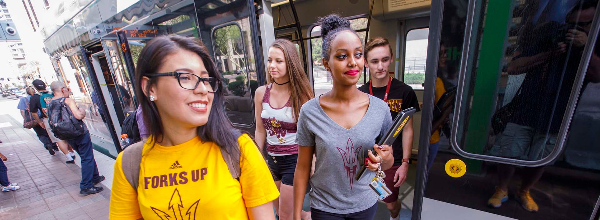 Students getting off the lightrail